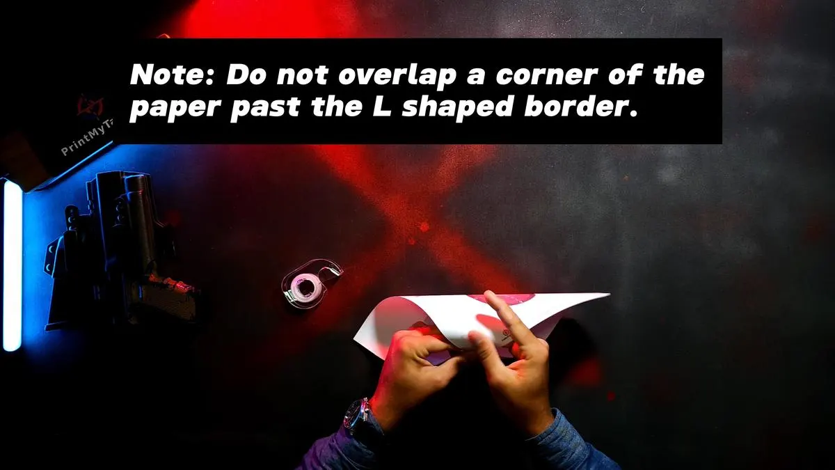 Note: Do not overlap a corner of the paper past the L shaped border.